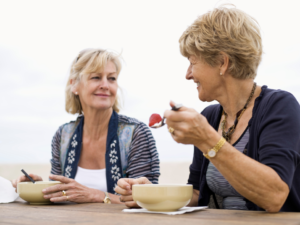 women eating together outside