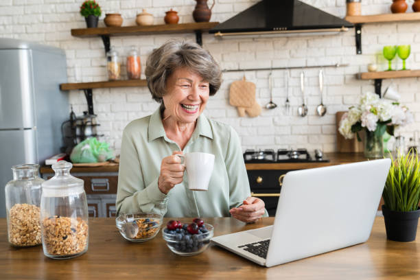 Image of a dietitian holding a stack of papers in hand which are test results. old woman working with DVD.