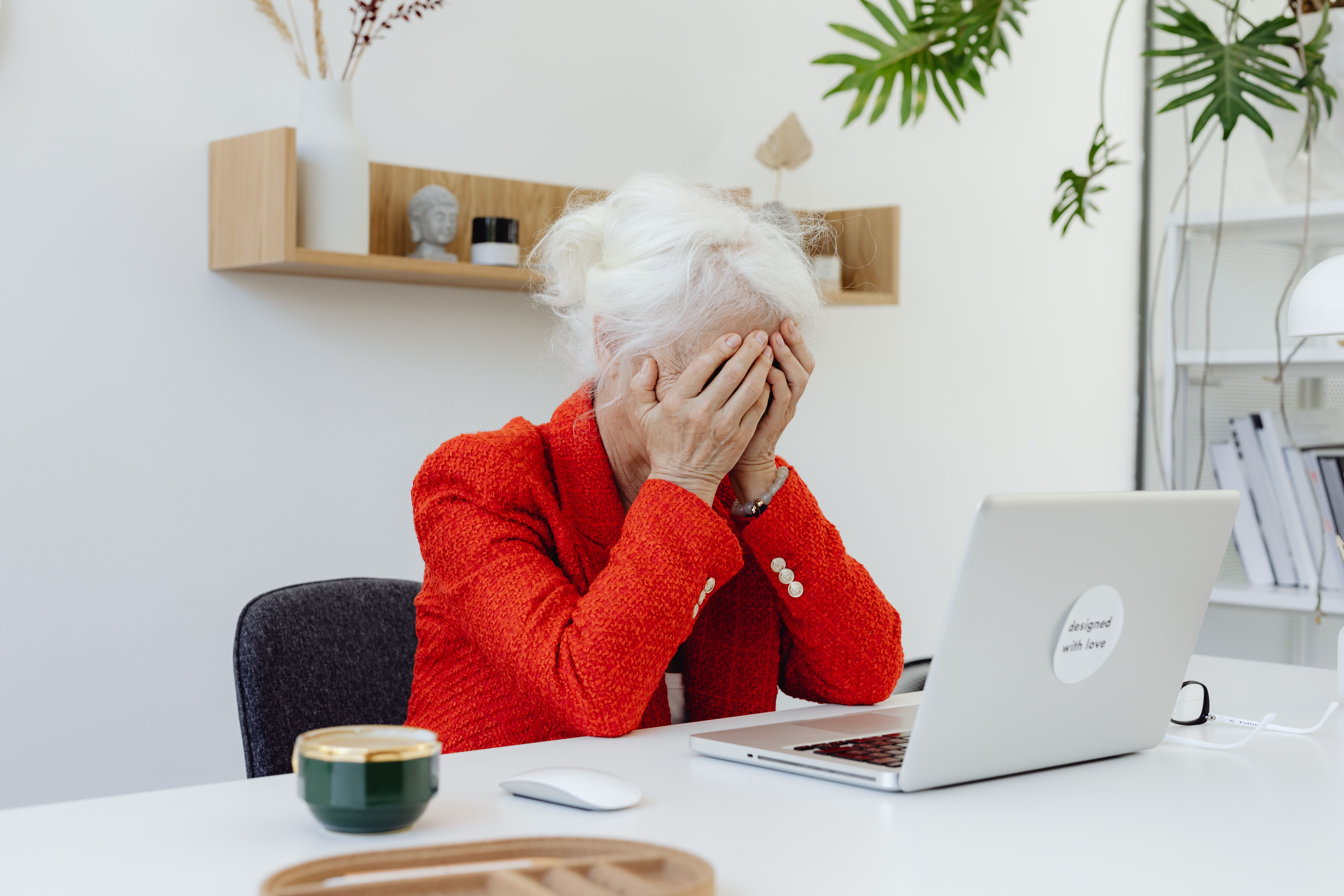 Image of a dietitian holding a stack of papers in hand which are test results. older woman dealing with stress and an upset gut.