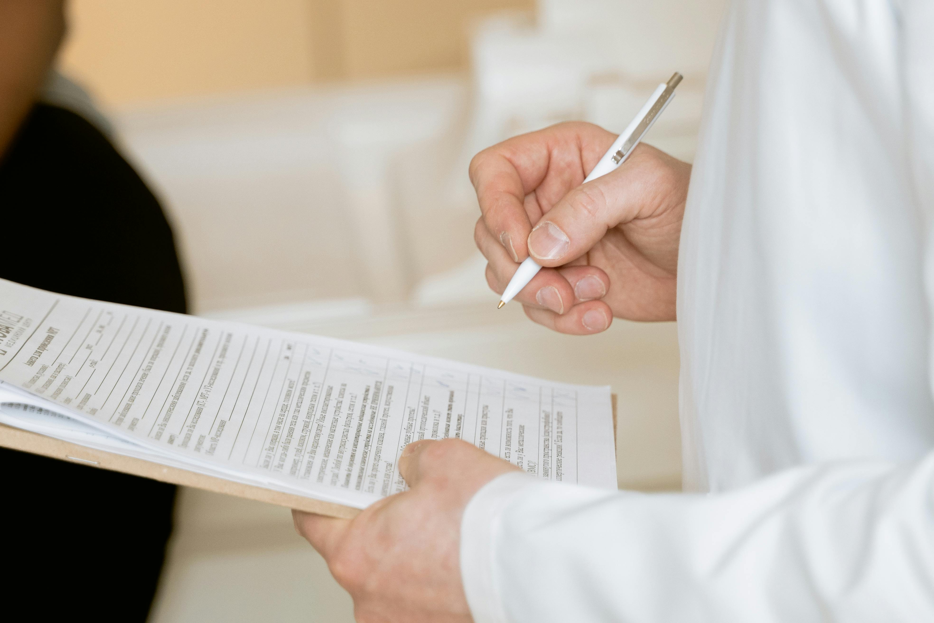 Image of a dietitian holding a stack of papers in hand which are test results.
